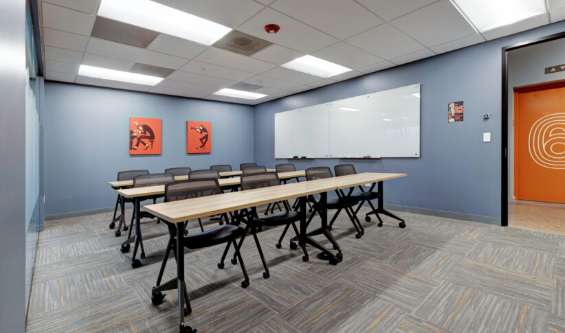 Large comfortable training room with huge white boards, privacy frost, rearrangeable furniture, large TV for display