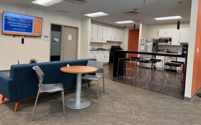 Office Evolution Burlington Suite 100 Common Area with seating and kitchen space.